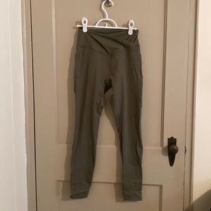 leggings. Cross cross waist band. Pockets. Size medium. Washed once never worn